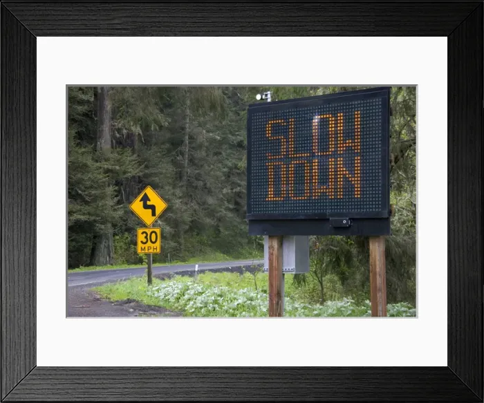 Framed Print : Radar operated digital road sign warning motorists to slow down on U. S. 101 north of Eureka Framed Print : Radar operated digital road sign warning motorists to slow down on U. S. 101 north of Eureka