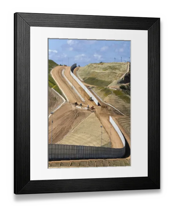 Framed Print : Construction of the border fence that prevents illegal immagrant crossings at the U Framed Print : Construction of the border fence that prevents illegal immagrant crossings at the U