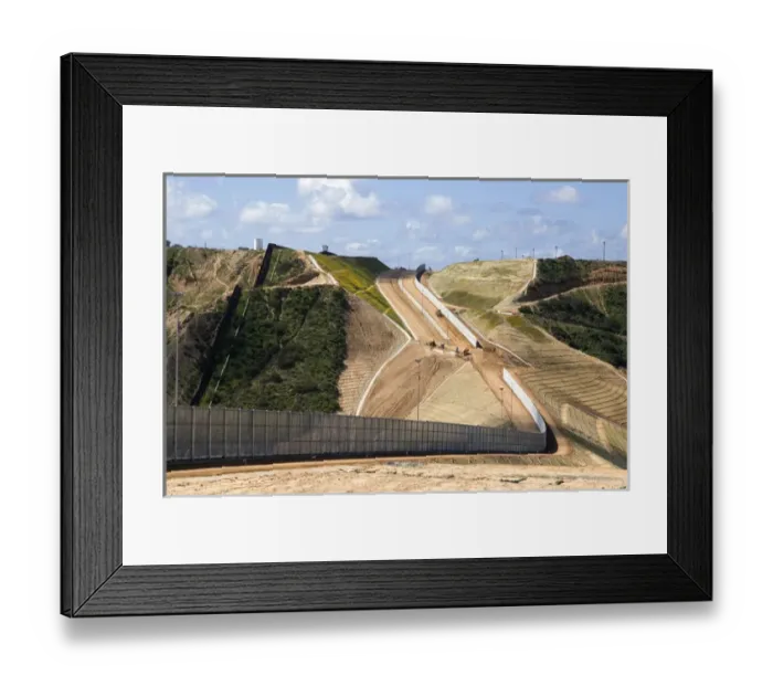 Framed Print : Construction of the border fence that prevents illegal immagrant crossings at the U Framed Print : Construction of the border fence that prevents illegal immagrant crossings at the U