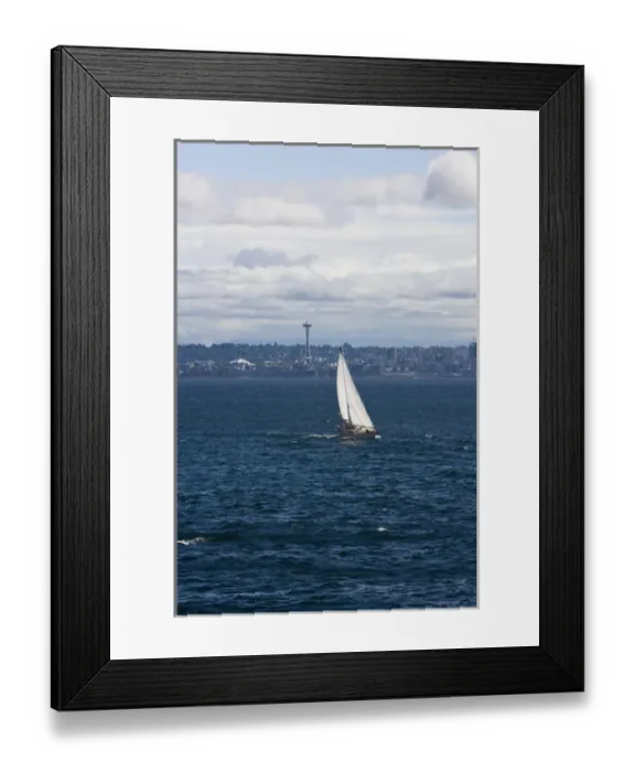 Framed Print : A small sailboat is propelled by a strong burst of wind off the coast of Seattle Framed Print : A small sailboat is propelled by a strong burst of wind off the coast of Seattle