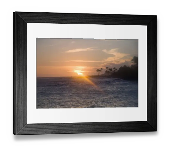 Framed Print : Kauai, Hawaii. A late afternoon sunset overlooking the rocky volcanic rocks and ocean