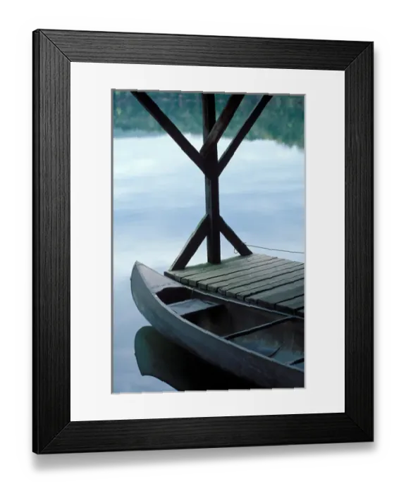 Framed Print : A canoe rests at the dock in first light of morning