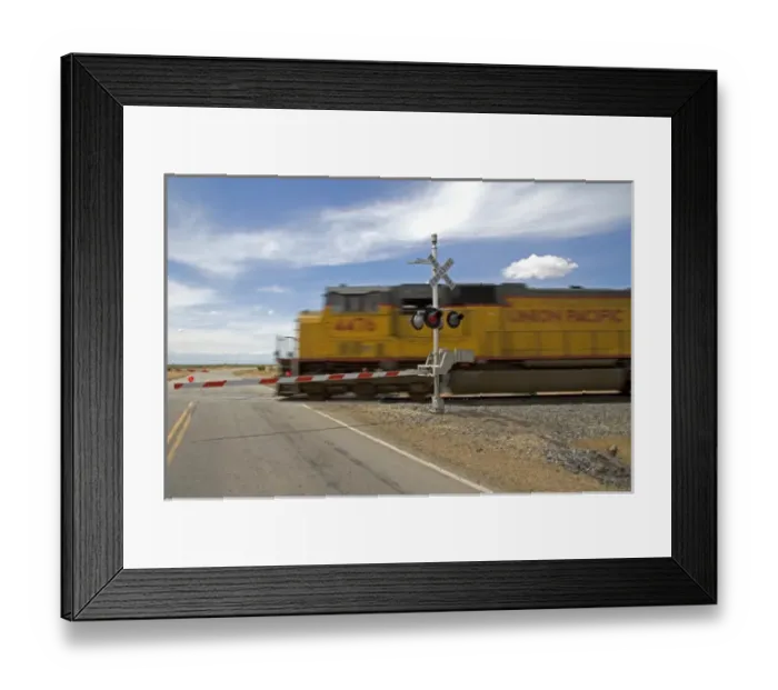 Framed Print : Union Pacific locomotive at a railroad crossing near Mountain Home, Idaho