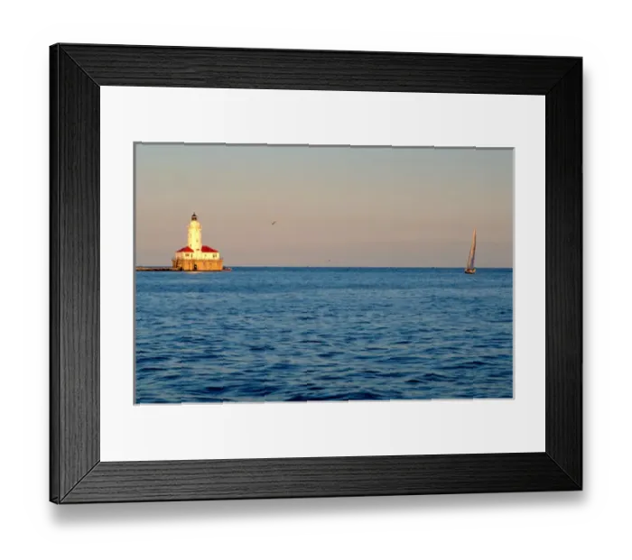 Framed Print : A lighthouse and sailboat on Lake Michigan, Chicago, Illinois. lighthouse