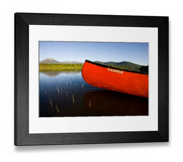 Framed Print : A canoe in early morning on Maines Katahdin Lake. Mount Katahdin is in the distance