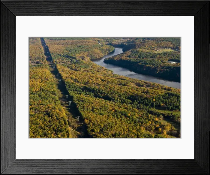 Framed Print : Power lines cut a swath through the forest next to the Connecticut River in Gill Framed Print : Power lines cut a swath through the forest next to the Connecticut River in Gill