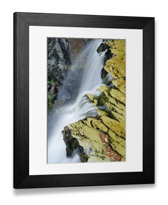 Framed Print : Water cascades over Rockwell Falls in Glacier National Park in Montana