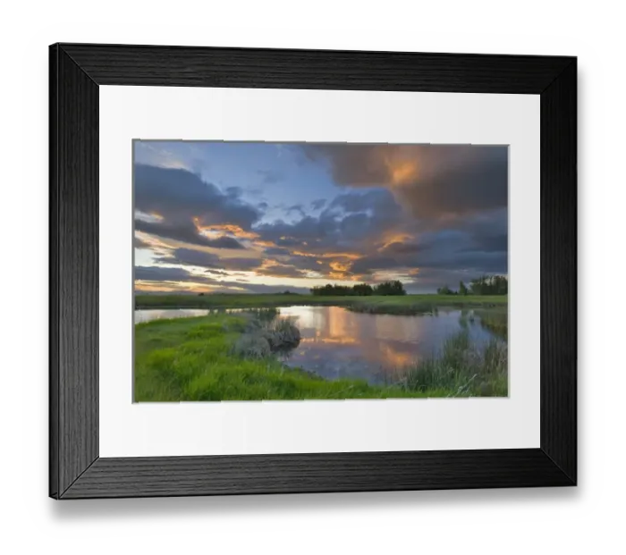 Framed Print : Vivid sunset clouds reflect into small pond at the Ninepipe Wildlife Management Area