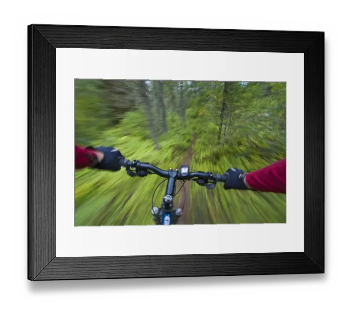 Framed Print : Cruising down a buff section of singletrack trail from the riders perspective near