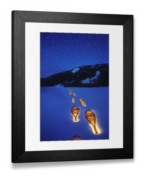 Framed Print : Snowshoes lighted by flashlight across Lake McDonald in Glacier National Park in
