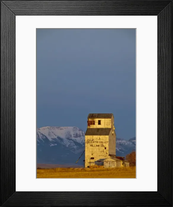 Framed Print : Old Gallatin Valley Mill Granary with the Rocky Mountains in background near Choteau