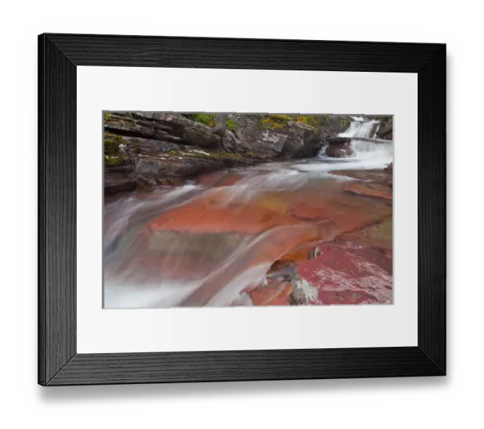 Framed Print : Water cascades down the red rock of Virginia Creek in Glacier National Park, Montana, USA
