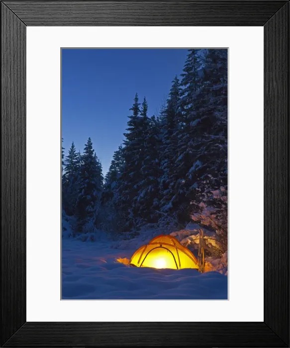 Framed Print : Tent glows at dusk during winter camping near West Glacier, Montana, USA