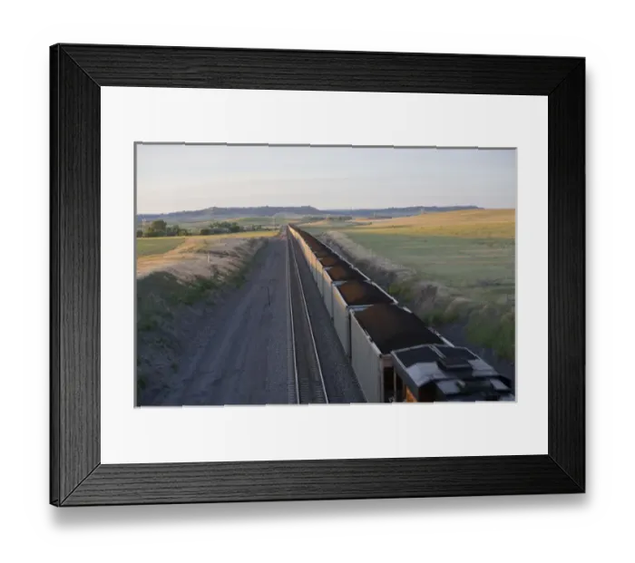Framed Print : Another extremely long load of coal carried by train from Wyoming passes through