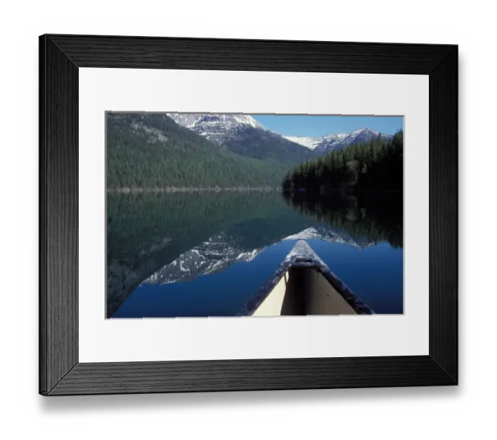 Framed Print : canoe on a placid lake along the eastern side of Glacier National Park, Montana Framed Print : canoe on a placid lake along the eastern side of Glacier National Park, Montana