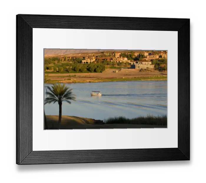 Framed Print : A small boat makes a wake in Lake Las Veagas with new homes in the background