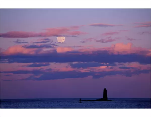 A full moon rises behind Whaleback Lighthouse. New Castle Common, New Castle, NH