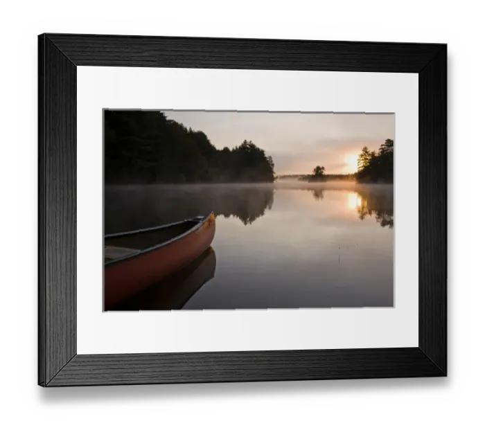 Framed Print : A canoe rests on the shore of Pawtuckaway Lake at dawn as seen from Horse Island Framed Print : A canoe rests on the shore of Pawtuckaway Lake at dawn as seen from Horse Island