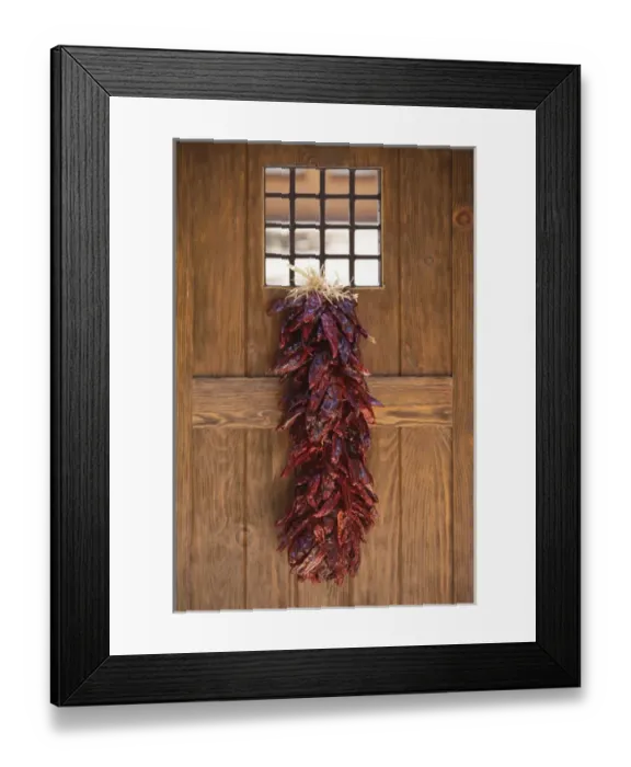 Framed Print : Santa Fe, New Mexico, United States. Traditional chile ristra hangs from door Framed Print : Santa Fe, New Mexico, United States. Traditional chile ristra hangs from door