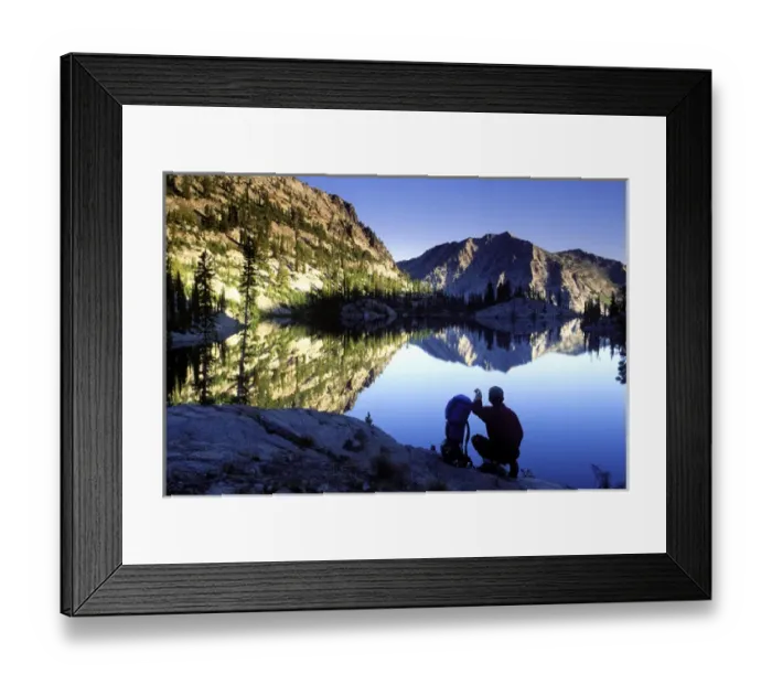 Framed Print : Hiker at sunset overlooking Looking Glass Lake in the Eagle Cap Wilderness, Oregon