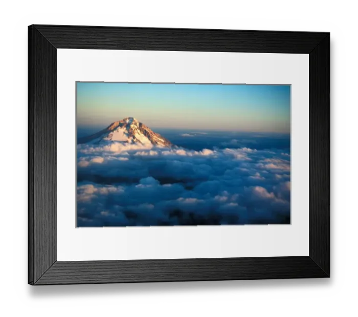 Framed Print : Aerial view of snow covered Mt. Hood poking through the clouds just at an Oregon sunset Framed Print : Aerial view of snow covered Mt. Hood poking through the clouds just at an Oregon sunset