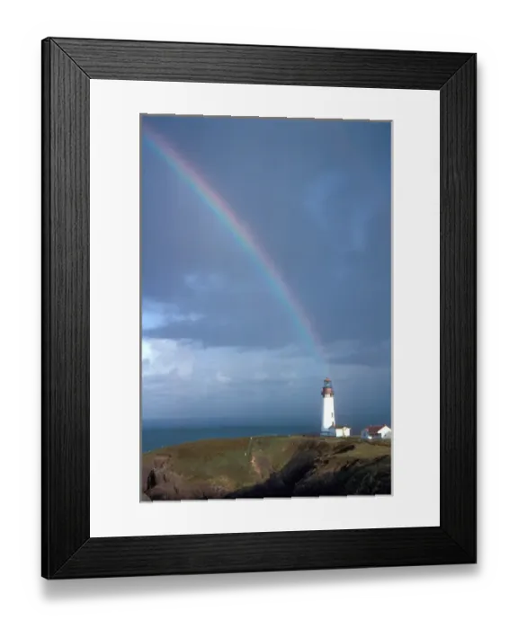 Framed Print : A rainbow hangs above the Yaquina Lighthouse, on Yaquina Head, above the Pacific Ocean near Newport