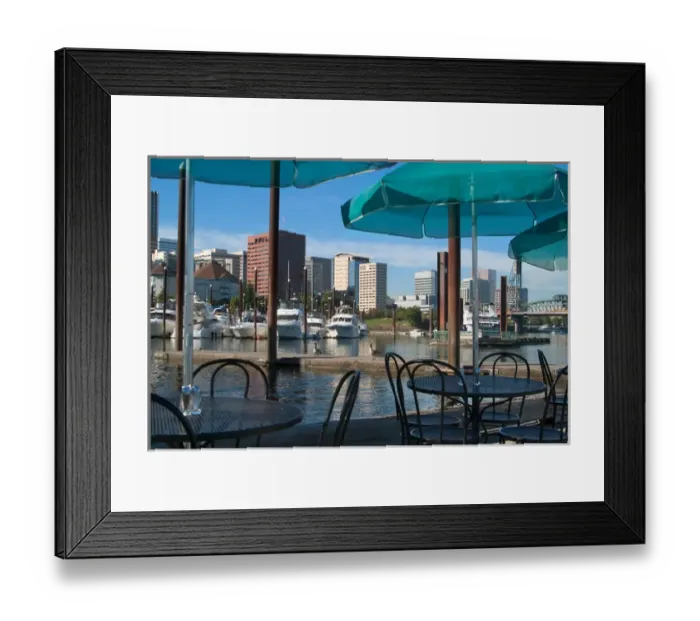 Framed Print : Tables with green umbrellas at a restaurant on the Willamette River, with the Portland Marina
