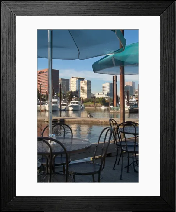 Framed Print : Tables with green umbrellas at a restaurant on the Willamette River, with the Portland Marina