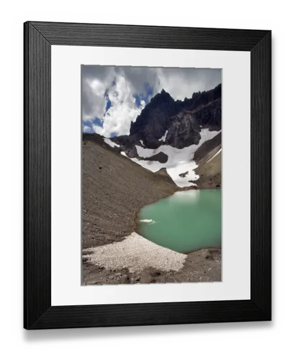 Framed Print : USA, Oregon, Three Fingered Jack. A small iceberg floats in the tarn below Three