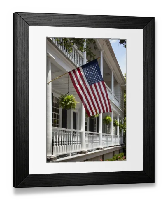 Framed Print : USA, South Carolina, Charleston, American flag flies from porch of historic home Framed Print : USA, South Carolina, Charleston, American flag flies from porch of historic home