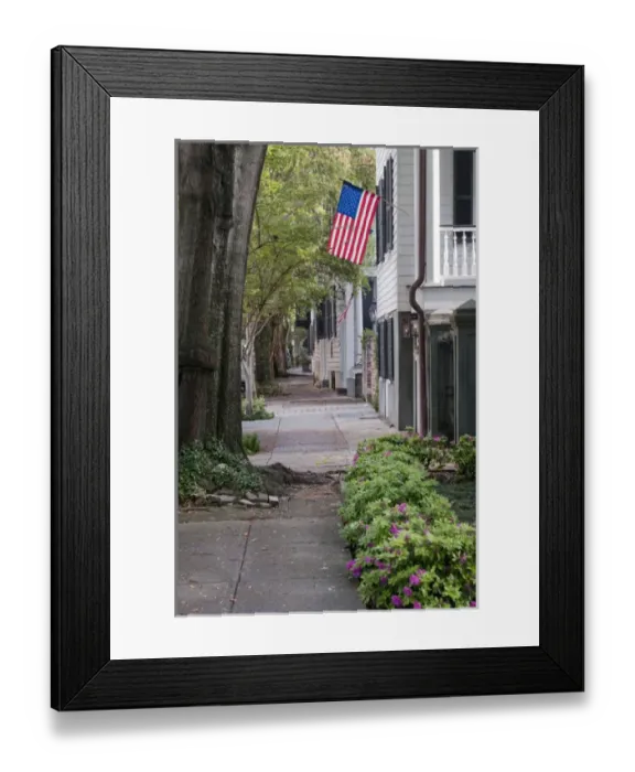 Framed Print : Charleston, South Carolina, USA. A flag hangs from a house in the historic district