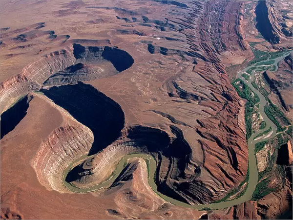 Aerial view of the San Juan River cutting through Raplee Anticline west of the town of Bluff