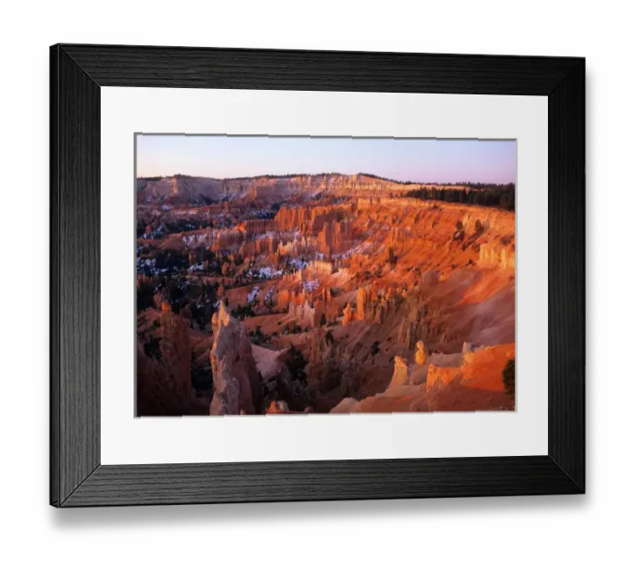 Framed Print : USA, Utah, Sun setting on Bryce Canyon, with snow clinging to the red cliffs