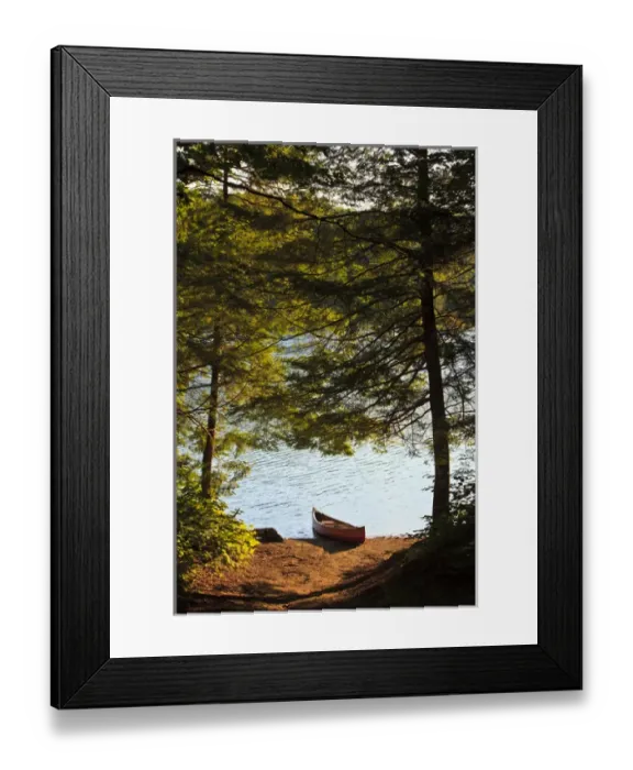 Framed Print : Canoe on the shore next to Zack Woods Pond in Hyde Park, Vermont