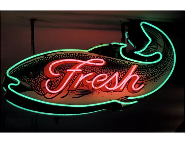 USA, Washington State, Seattle. Neon seafood sign at the Pike Place Market