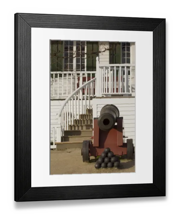 Framed Print : An antique cannon sits outside of the entrance to the officers quarters at Fort Vancouver Framed Print : An antique cannon sits outside of the entrance to the officers quarters at Fort Vancouver