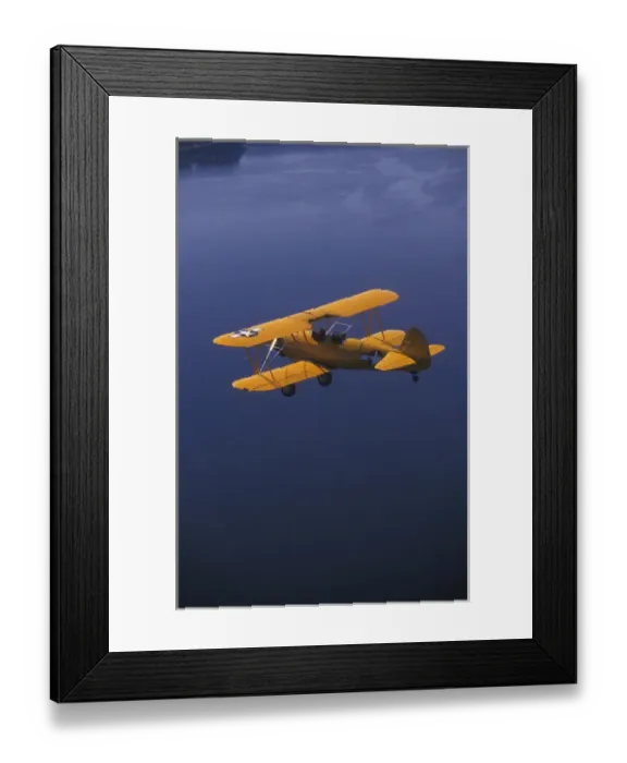 Framed Print : P. R. Yellow Biplane, 1944 Stearman PT-17, flying over Puget Sound, WA