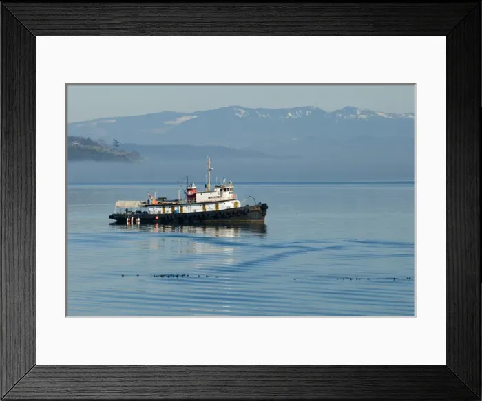 Framed Print : Live-aboard tugboat anchored in Penn Cove with Cascade Mountains beyond