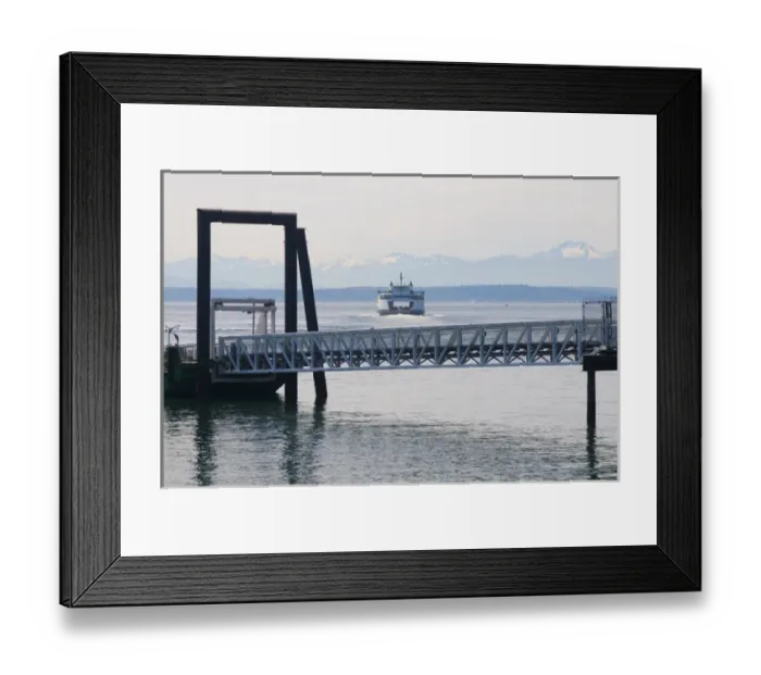Framed Print : Washington State ferry arriving at terminal in downtown Seattle. Olympic Mountains
