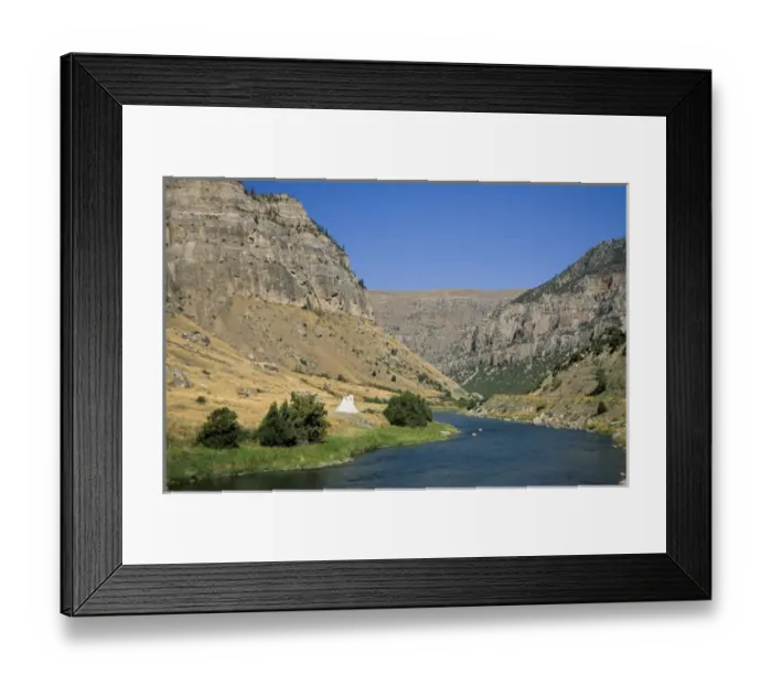 Framed Print : Tipi sits on the banks of the Wind River that winds through a steep walled canyon