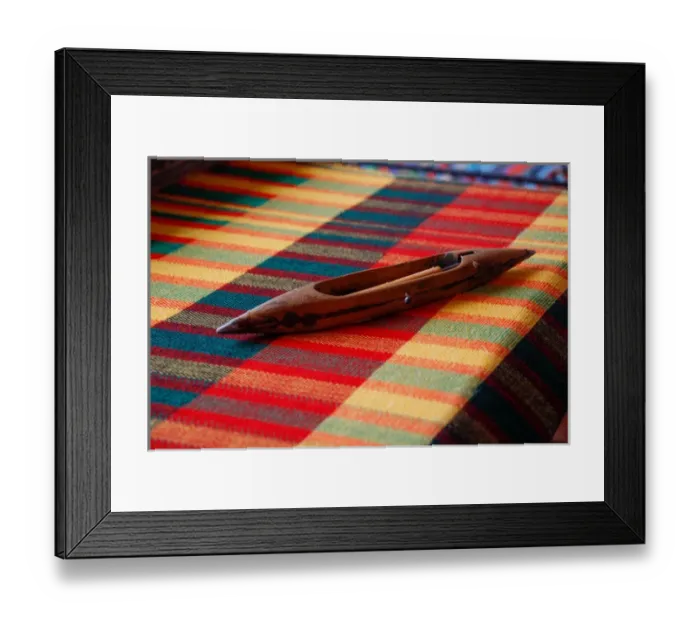 Framed Print : Africa, Egypt. Weaving shuttle lying on colorful woven Egyptian fabric Framed Print : Africa, Egypt. Weaving shuttle lying on colorful woven Egyptian fabric