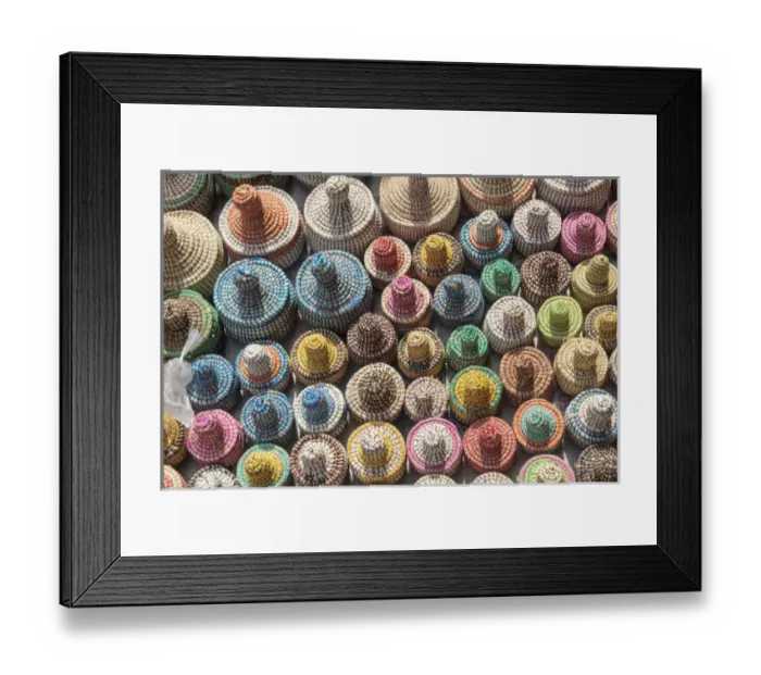 Framed Print : West Africa, The Gambia, Banjul. A collection of colorful woven baskets viewed from above