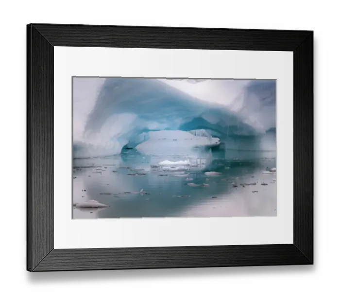 Framed Print : Antarctica. Artistic open arch in an iceberg