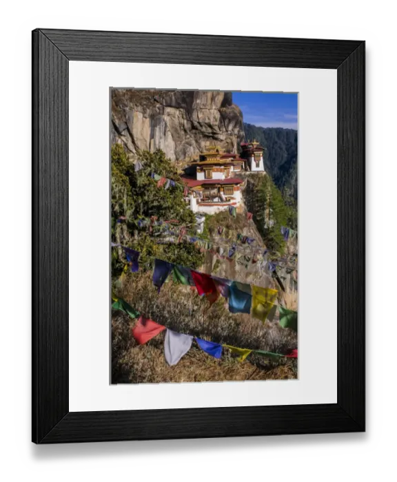 Framed Print : Praying flags before the Tiger-Nest, Taktshang Goempa monastery hanging in the cliffs