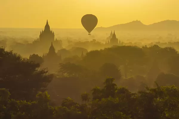 Myanmar. Bagan. Hot air balloons rising over the temples of Bagan