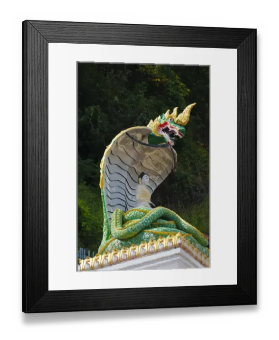 Framed Print : Statue of Buddha meditating with his weight supported by the coils of a naga (snake) Framed Print : Statue of Buddha meditating with his weight supported by the coils of a naga (snake)