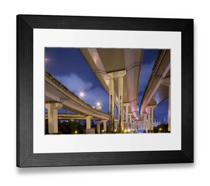 Framed Print : China, Shanghai, Towering overpass of Yanaaan Expressway with city skyline in distance