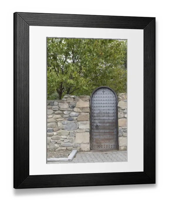 Framed Print : Georgia, Mtskheta. A metal door and rock wall Framed Print : Georgia, Mtskheta. A metal door and rock wall