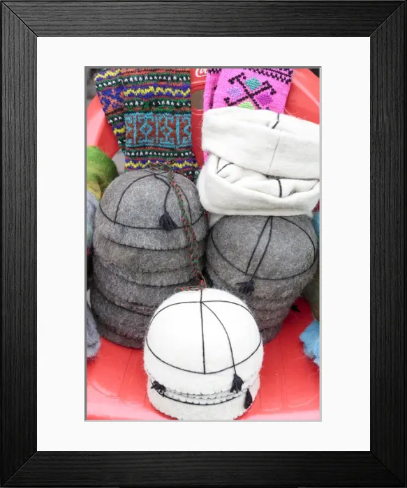 Framed Print : Georgia, Mtskheta. A collection of traditional hats for sale as souveniers