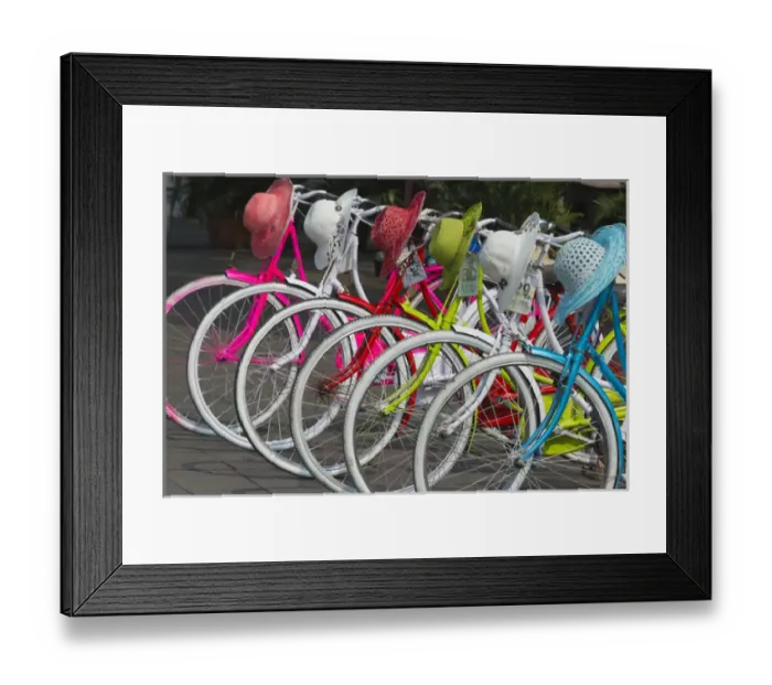 Framed Print : Bicycles and colorful straw hats on the street, Jakarta, Indonesia Framed Print : Bicycles and colorful straw hats on the street, Jakarta, Indonesia
